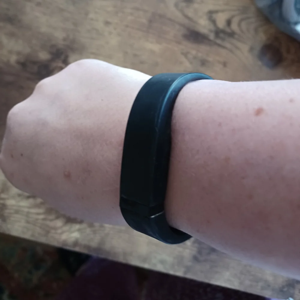 Fitbit Flex w/ black strap I will throw in a set extra straps